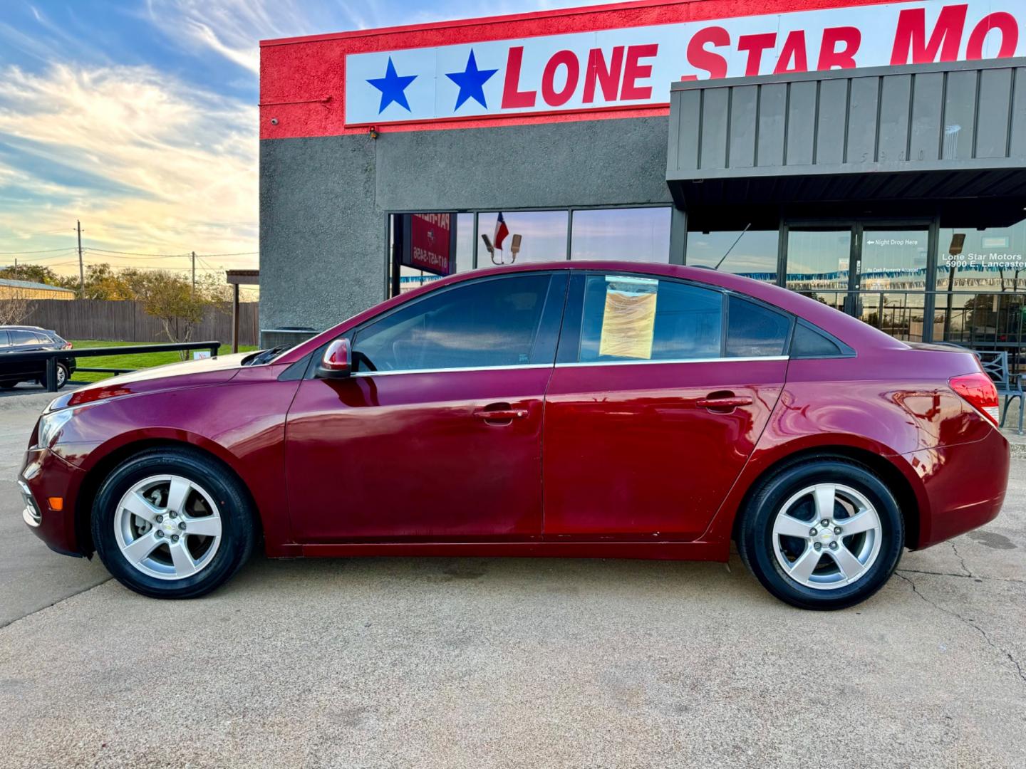 2016 RED /Gray CHEVROLET CRUZE LIMITED 1LT 1LT Auto 4dr Sedan w/1SD (1G1PE5SB1G7) with an 1.4L I4 Turbocharger engine, Automatic 6-Speed transmission, located at 5900 E. Lancaster Ave., Fort Worth, TX, 76112, (817) 457-5456, 0.000000, 0.000000 - This is a 2016 Chevrolet Cruze Limited 1LT Auto 4dr Sedan w/1SD that is in excellent condition. There are no dents or scratches. The interior is clean with no rips or tears or stains. All power windows, door locks and seats. Ice cold AC for those hot Texas summer days. It is equipped with a CD playe - Photo#3